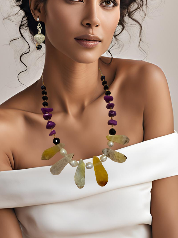 Morrocan woman in white dress wearing handmade yellow quartz purple agate necklace