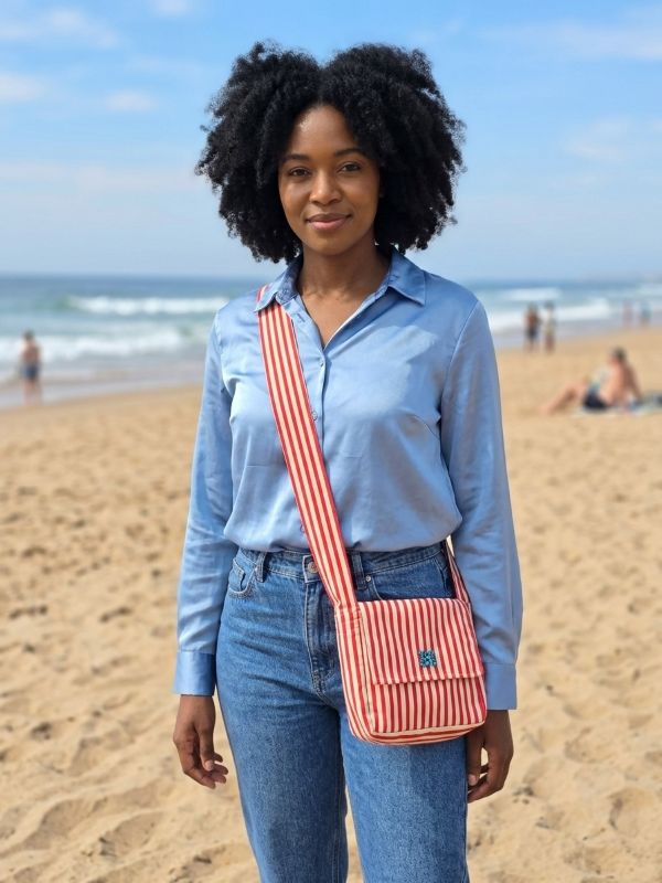 Red stripe crossbody bag on model